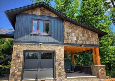 garage exterior with stone veneer